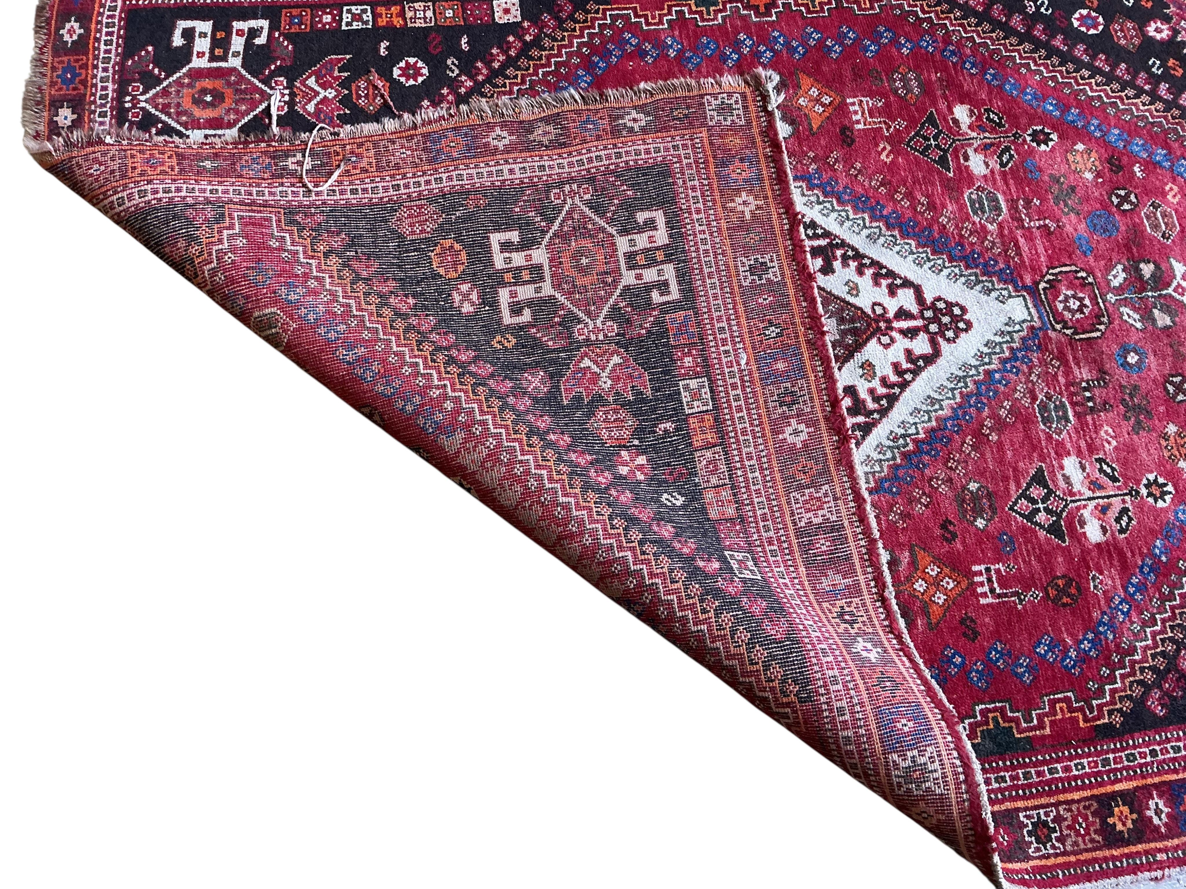 A Hamadan red ground rug, 176 x 128cm together with a smaller Bokhara mat